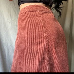 A warm orange, fall, ribbed skirt.
with buttons all the way down.